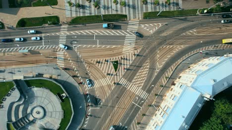 busy urban traffic. aerial top view traffic on circle road in city at day. 4k stock footage.