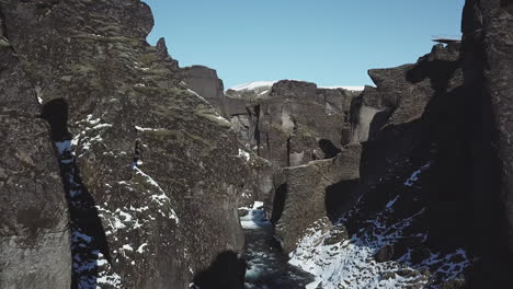 Aerial-View-Drone-Flying-in-beautiful-scenery-between-mountains-in-cold-Iceland