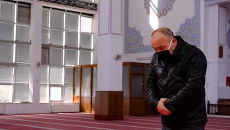 Middle-Aged-Man-Prays-In-A-Masked-In-A-Mosque-2