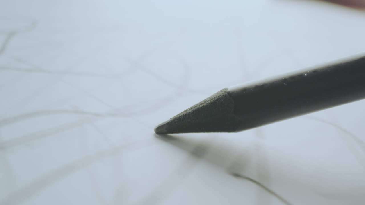 Closeup of a pencil sketching on paper