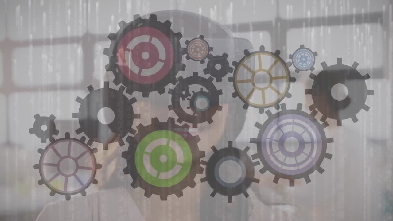 Animation of cogs moving over woman wearing vr headset
