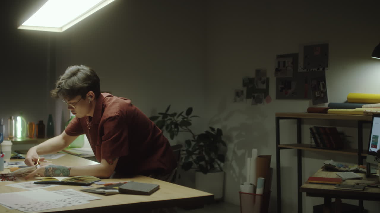 Creative Professional Working at a Desk in a Studio