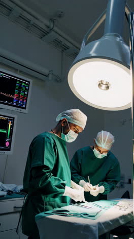 surgeons performing a surgical procedure in an operating room