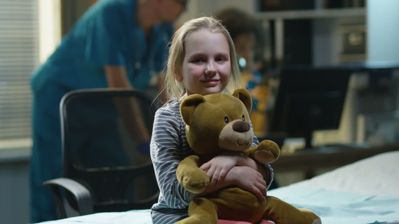 Child Patient in Hospital with Teddy Bear
