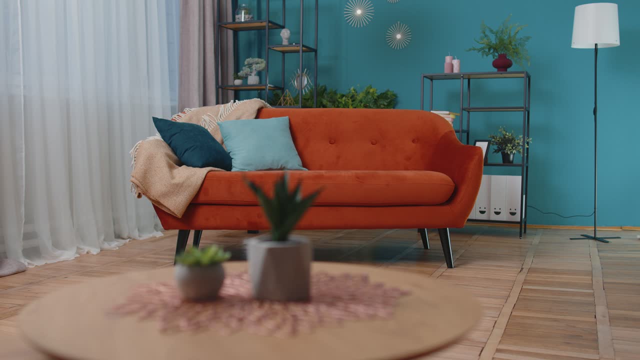 Child girl kid washes floors with a mop in domestic living room dancing singing in positive mood