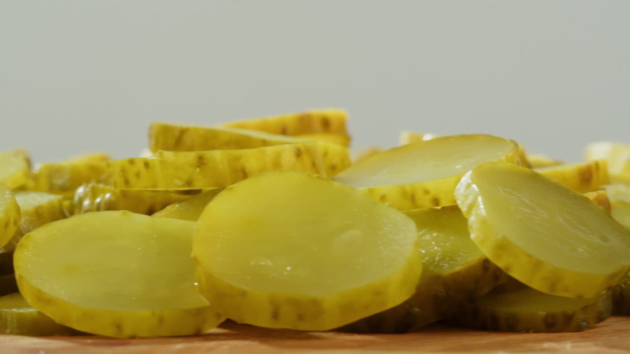 Sliced Pickles on Wooden Board