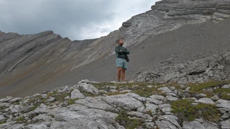 Hiker-admiring-mountain-view-approached-close-up-Rockies-Kananaskis-Alberta-Canada