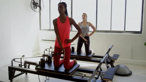 women doing exercise on rowing machine 4k