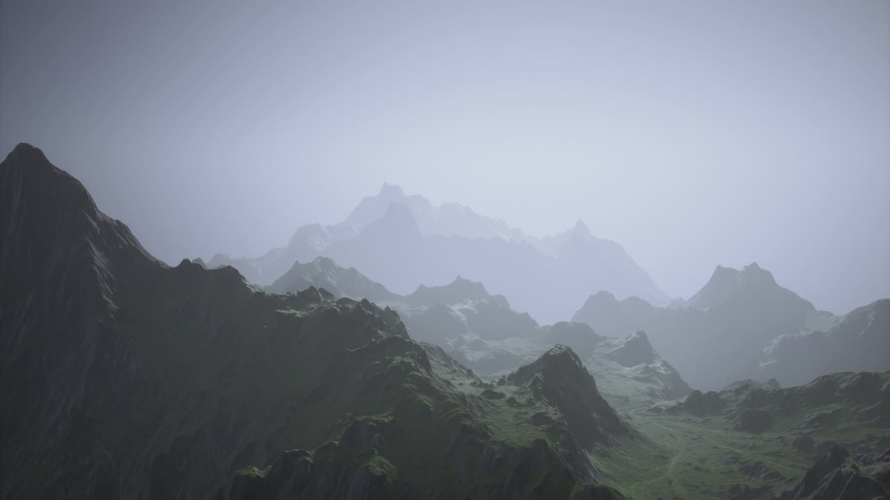 Majestic mountain landscape shrouded in mist during early morning hours