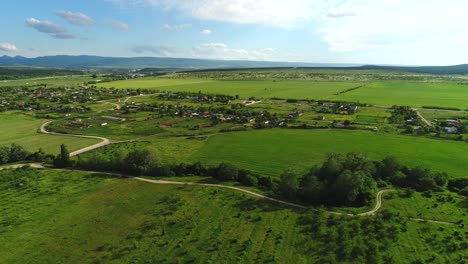 aerial view of a rural village and farmland