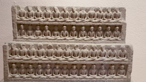 historic carving illustrating sahastra buddha at indoor