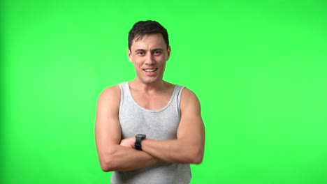 young man expressing emotions and gesturing on green screen