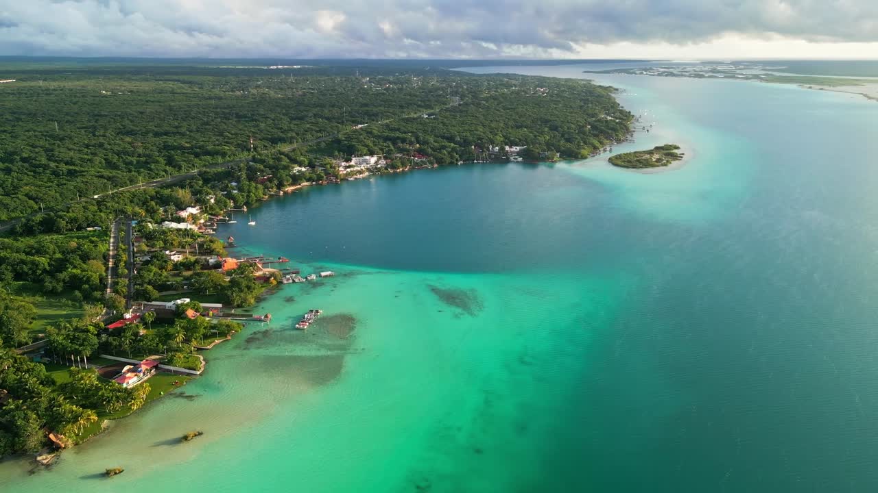 Serene aerial view of Bacalar lagoon in Mexico, turquoise waters and lush greenery