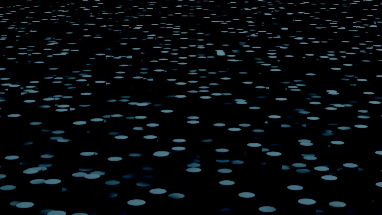 Gray circles move on the surface in the dark close up animation background