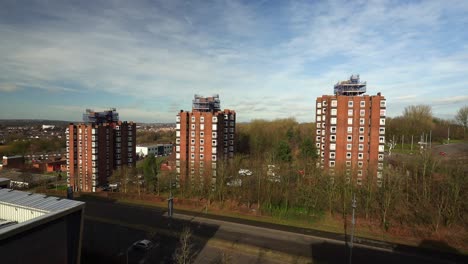 High-rise-tower-blocks,-flats-built-in-the-city-of-Stoke-on-Trent-to-accommodate-the-increasing-population,-housing-crisis-and-over-crowding,-immigration-housing