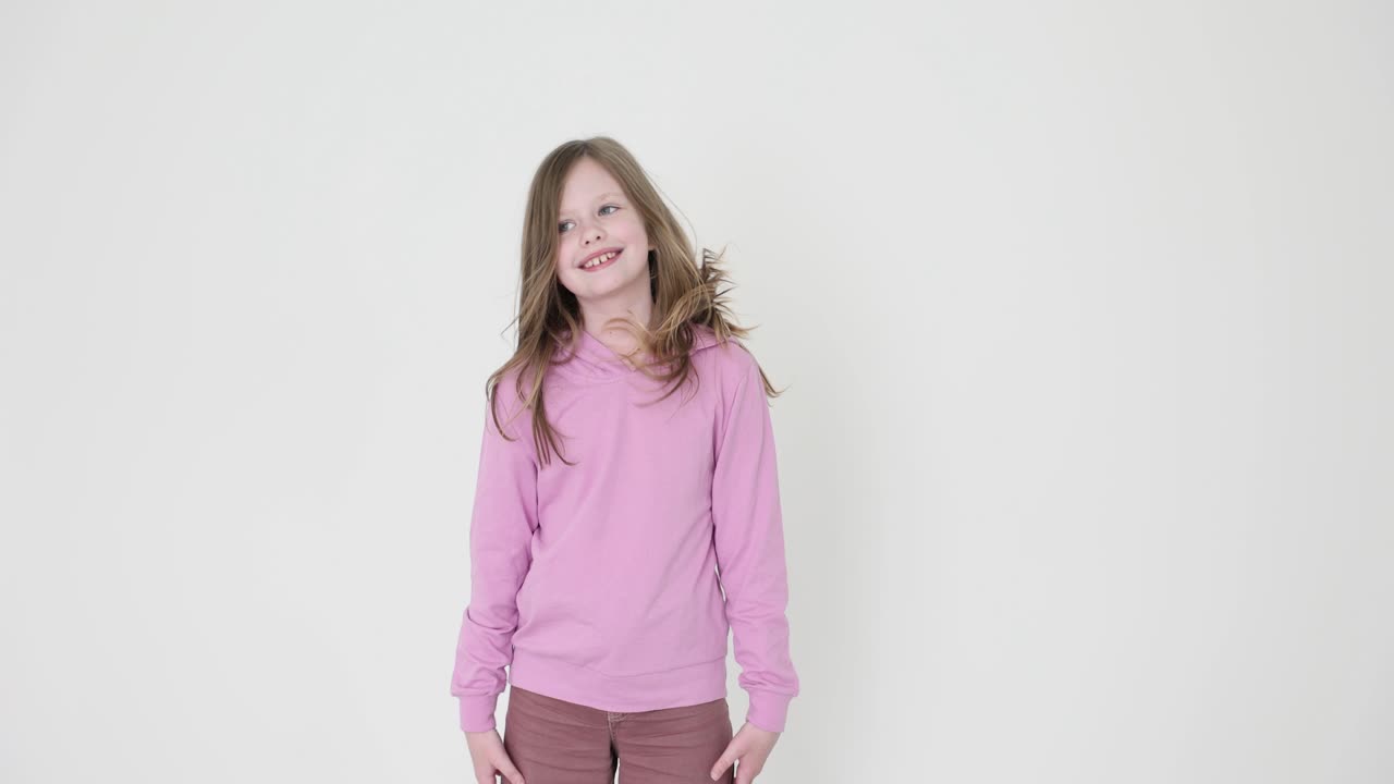 Happy Young Girl in Pink Hoodie on White Background