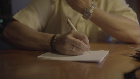 person writing notes