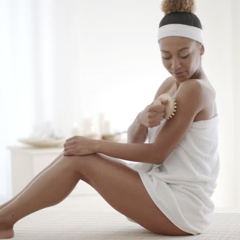 young woman scrubbing her leg