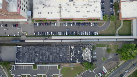 Aeria-drone-over-train-station,-train-depot,-descending