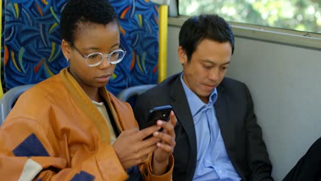 commuter using mobile phone while travelling in bus 4k