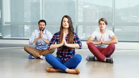 team of executives practicing yoga