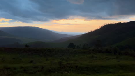 Stunning-scenic-sunset-Nelsprit-Mombela-Kruger-National-Park-South-Africa-roadtrip-Johannesburg-tstorm-lighting-rain-clouds-early-evening-lush-grass-mountain-landscape-cinematic-slider-to-the-right