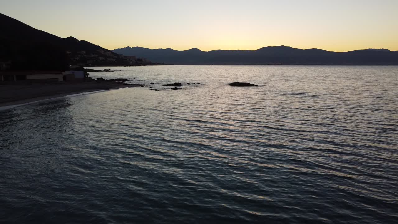 Flying towards the sunrise at the beach in corsica