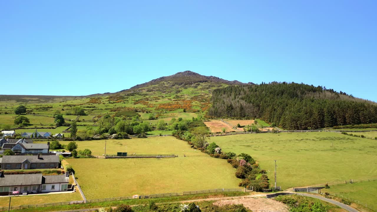 Reversing aerial video of the Cooley Mountains in Carlingford, County Louth, Ireland on a bright and sunny day. Filmed in 4K, 60FPS and with Rec709 color.