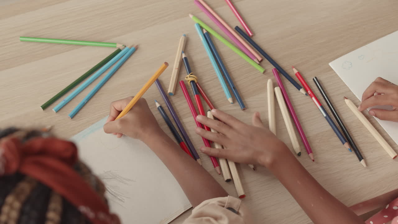 Children Drawing Postcards on Table