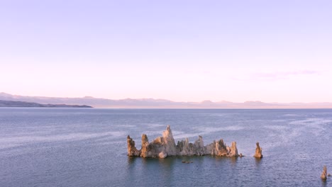 4k aerial of tufa rocks in mono lake, at sunset