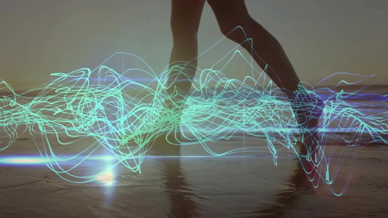 Mid-adult woman stepping into water causing technology teal blue waveforms syncing to footfalls