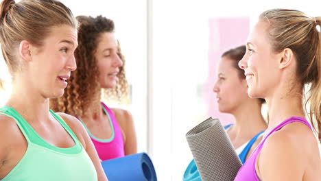 Smiling-athletic-women-discussing-together