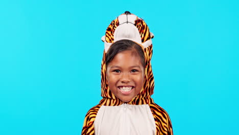 Excited,-tiger-costume-and-face-of-girl-in-studio