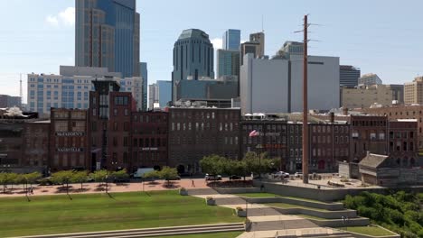 downtown nashville, tennessee city skyline on a sunny day - ascending aerial view