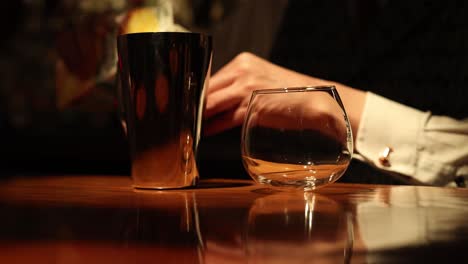 sequence of a bartender pouring water into a glass