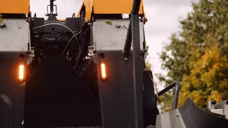 mechanical grape harvester positioning itself in the vineyard of a wine-farm