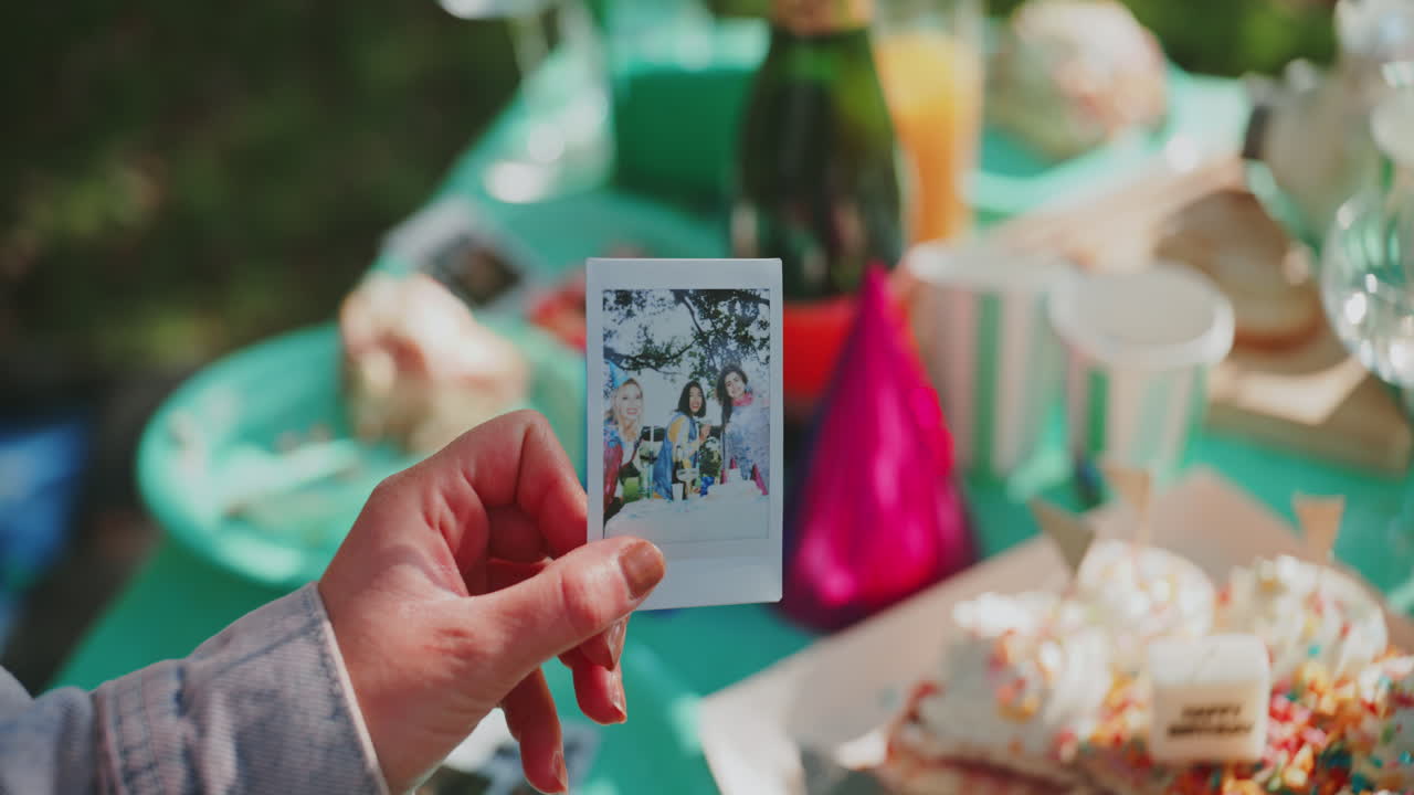 Friends celebrating a birthday at a picnic