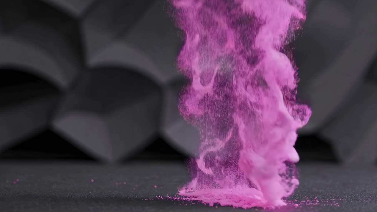 Pink Powder Falling on Dark Geometric Background