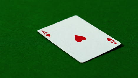 ace of hearts falling on casino table