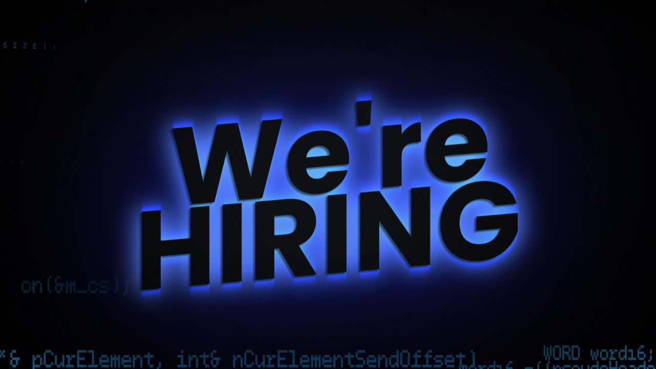 Animation of We're hiring text glowing over dark background with coding elements