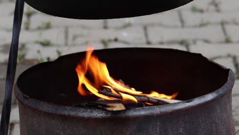 fire burning in a barrel, close up, static slowmo