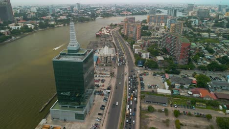 traffic and cityscape of falomo bridge, lagos law school and the civic centre tower in lagos nigeria