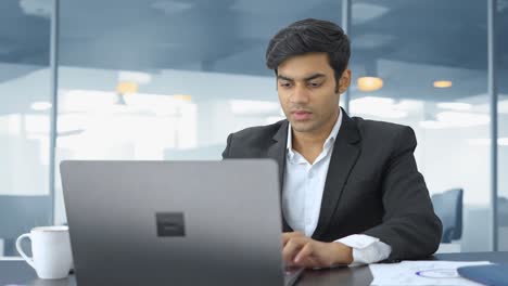 Smart-Indian-employee-working-in-office