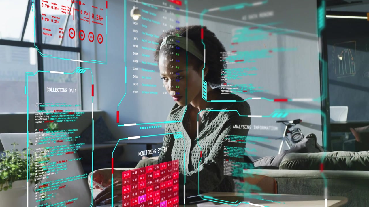 Woman typing on laptop in loft workspace, initiating AR HUD updating charts for data analysis