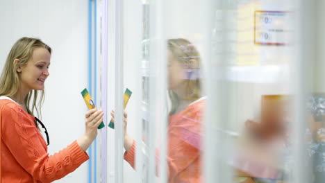 Woman-in-the-shop-taking-a-cosmetic-product