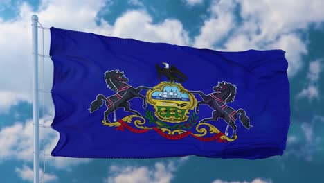 la bandera de pensilvania en un asta de bandera ondeando en el viento, fondo de cielo azul