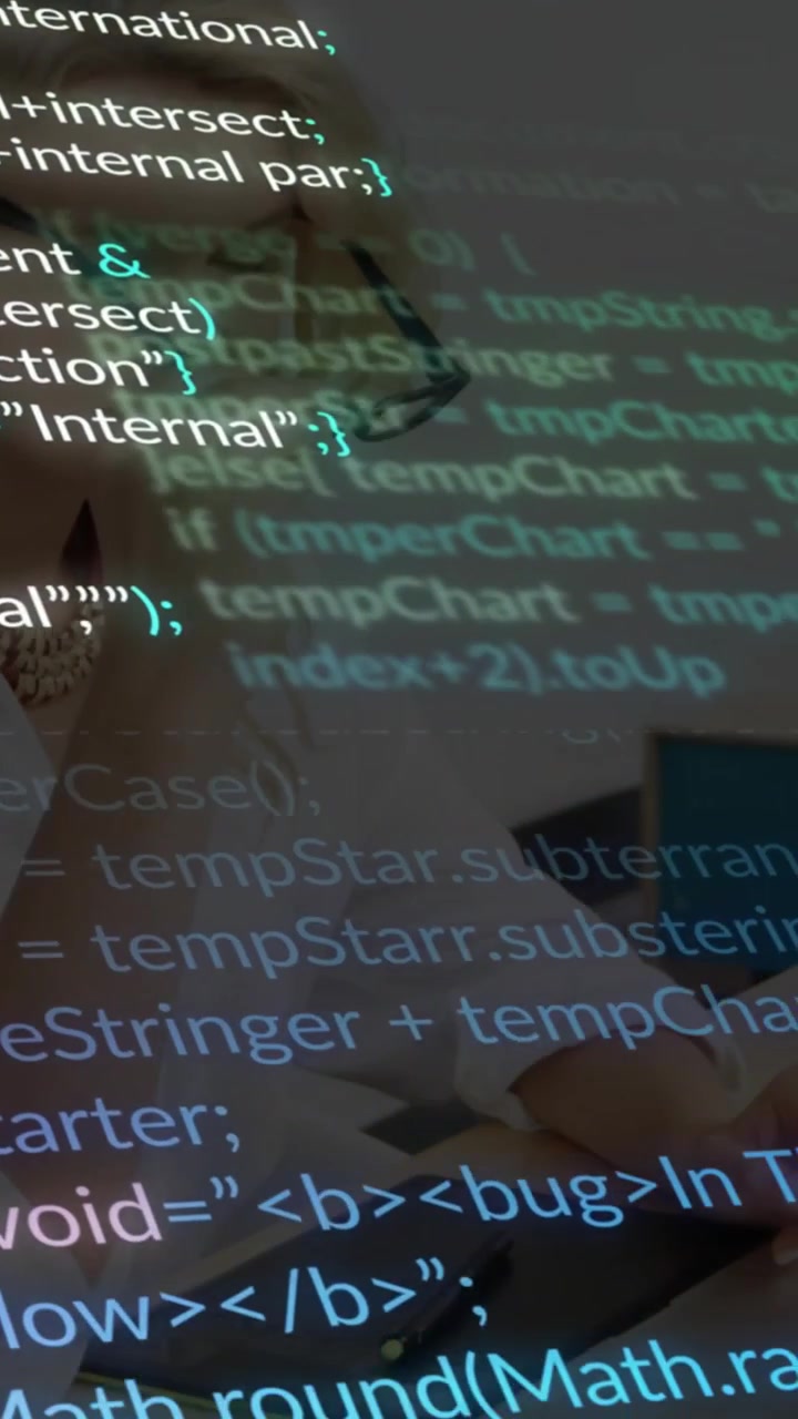 Vertical video: Woman reading screen starting code overlay over desk, reaching pen for code review