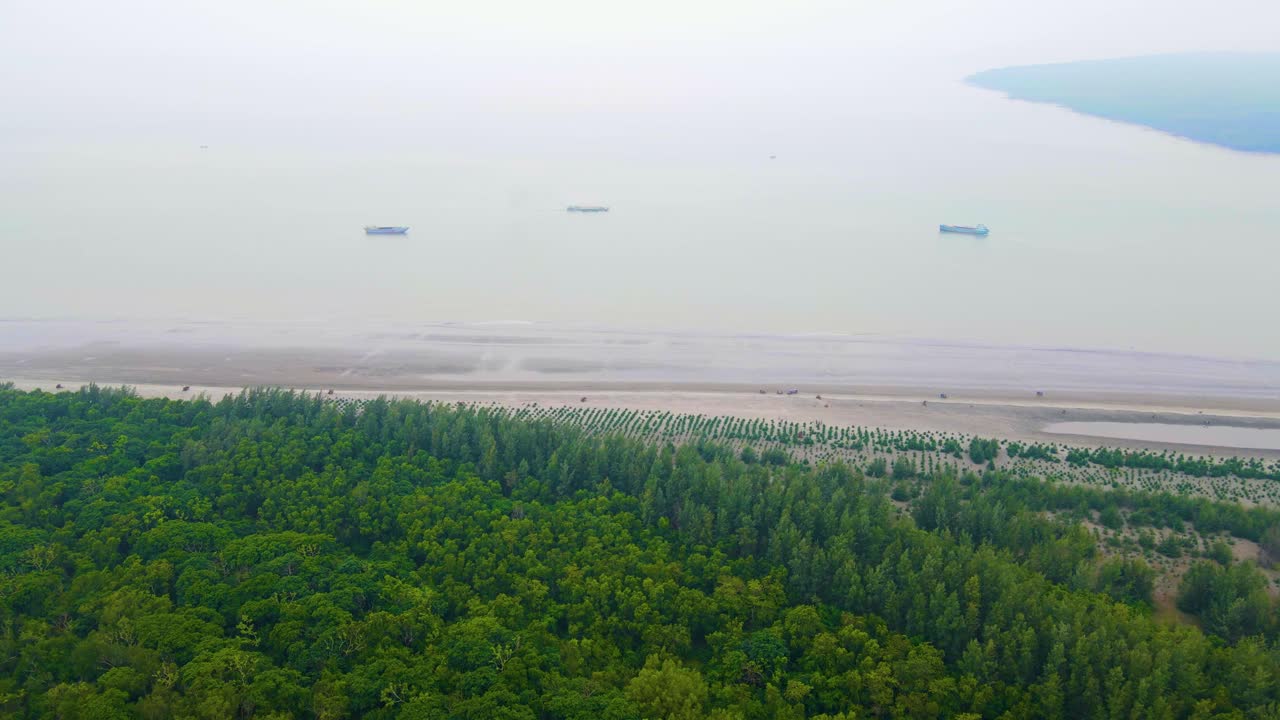 Sundarbans Forests coast With Cargo Ship Cruising at Sea Across The Bay Of Bengal In Bangladesh