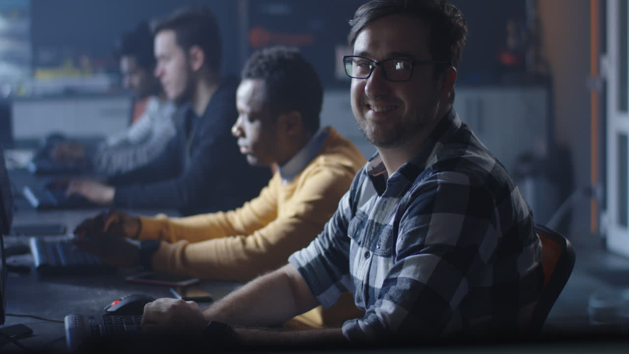 Diverse Group of Programmers Working on Computers