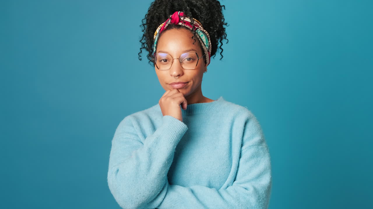 Portrait of a woman with headband and glasses